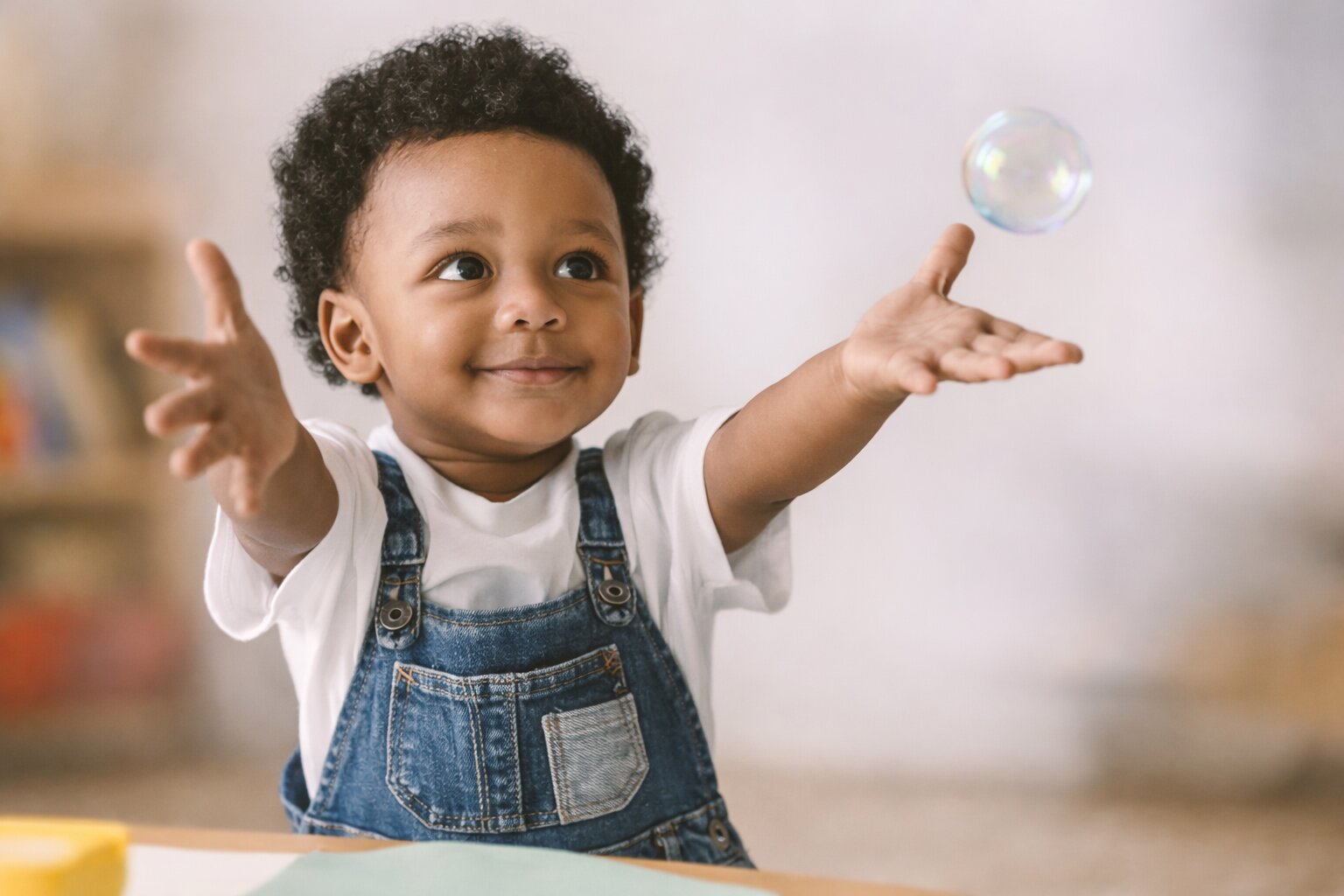 Toddler playing with letters